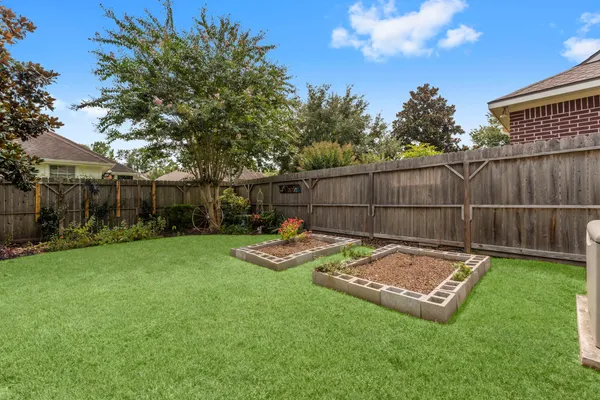 a view of a backyard with a garden