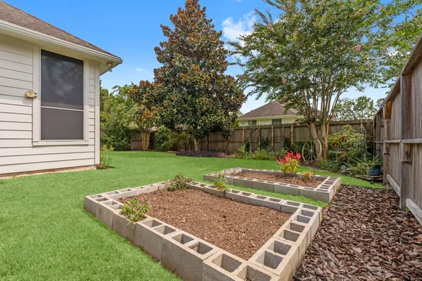 a view of yard with grass and trees
