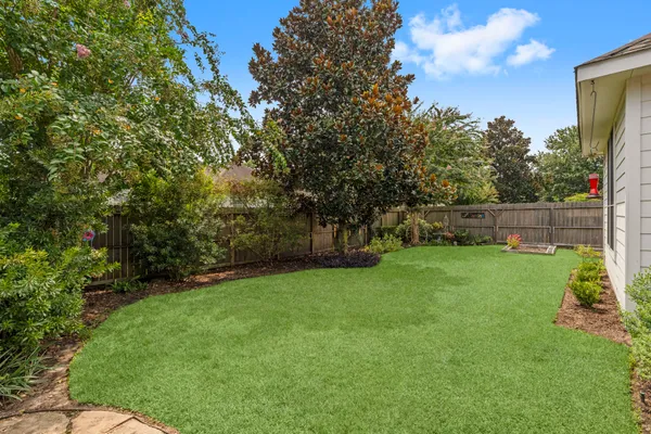 a view of a chairs and table in a patio