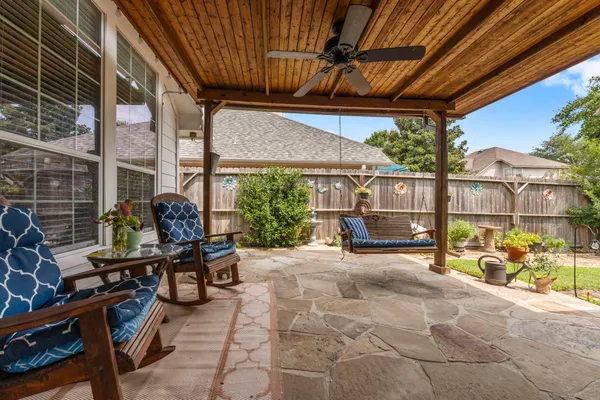 a living room with lots of furniture and a flat screen tv