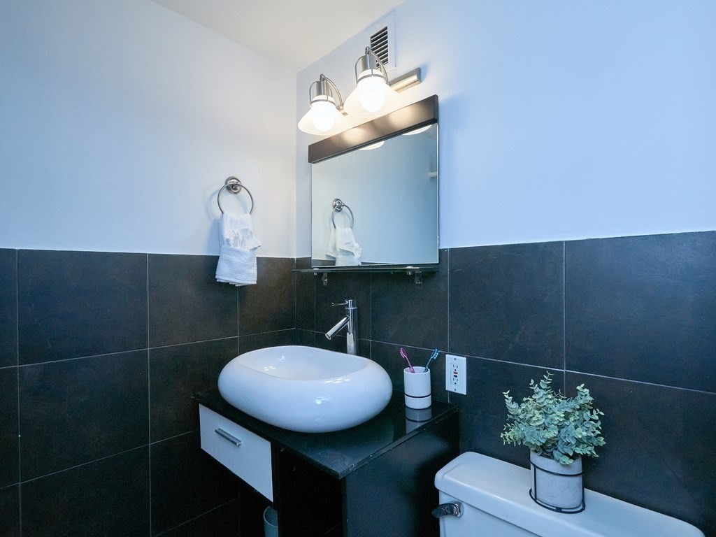 42 8th Street, Unit 5521 Boston, MA 02129 - Photo 12 of 25 a bathroom with a toilet and a sink