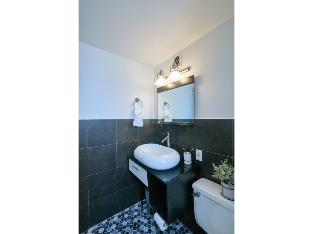 42 8th Street, Unit 5521 Boston, MA 02129 - Photo 13 of 25 a bathroom with a sink and a mirror
