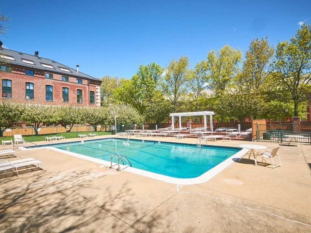 42 8th Street, Unit 5521 Boston, MA 02129 - Photo 14 of 25 a view of a house with a swimming pool