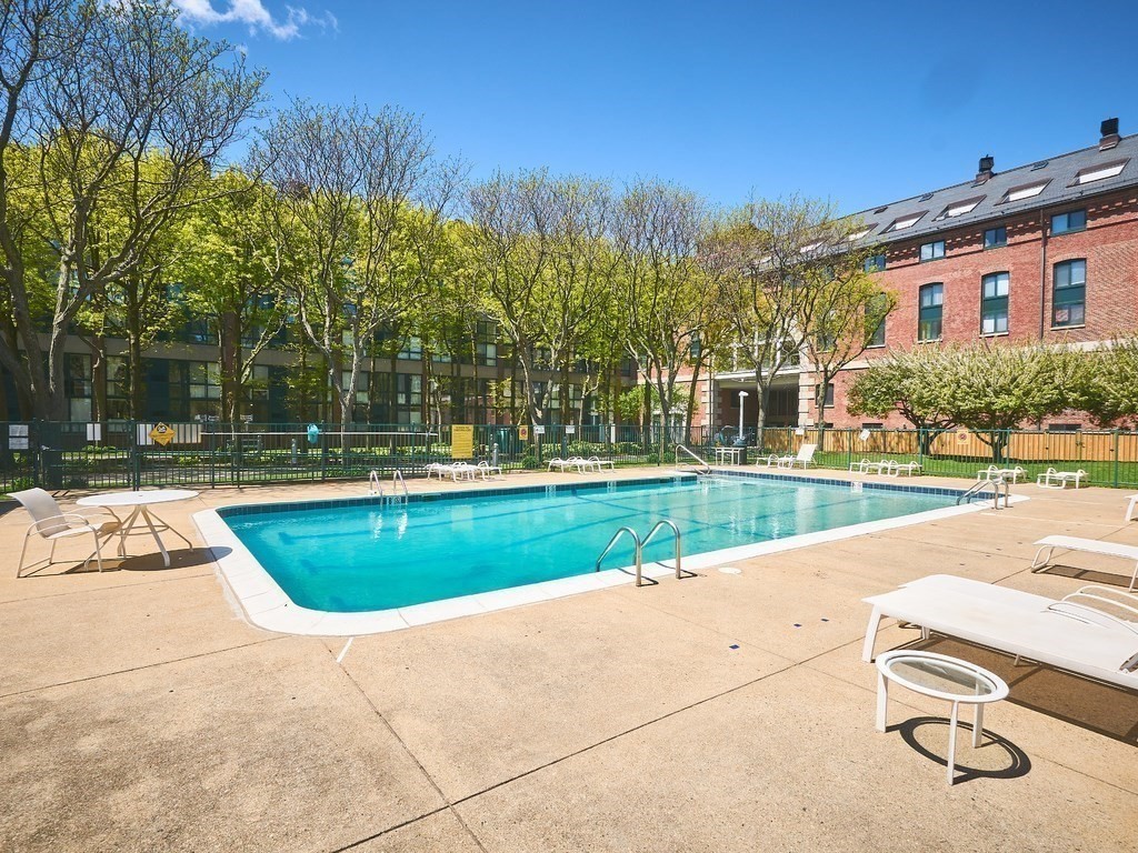 42 8th Street, Unit 5521 Boston, MA 02129 - Photo 15 of 25 a view of swimming pool with outdoor seating and yard in back