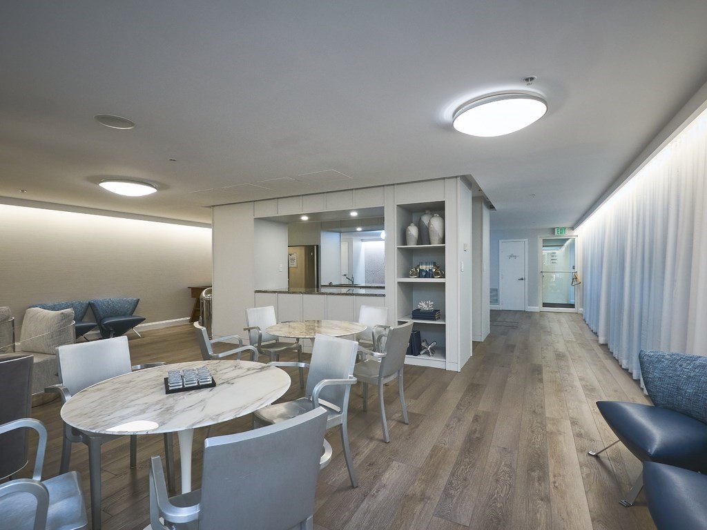 42 8th Street, Unit 5521 Boston, MA 02129 - Photo 19 of 25 a living room with furniture and wooden floor