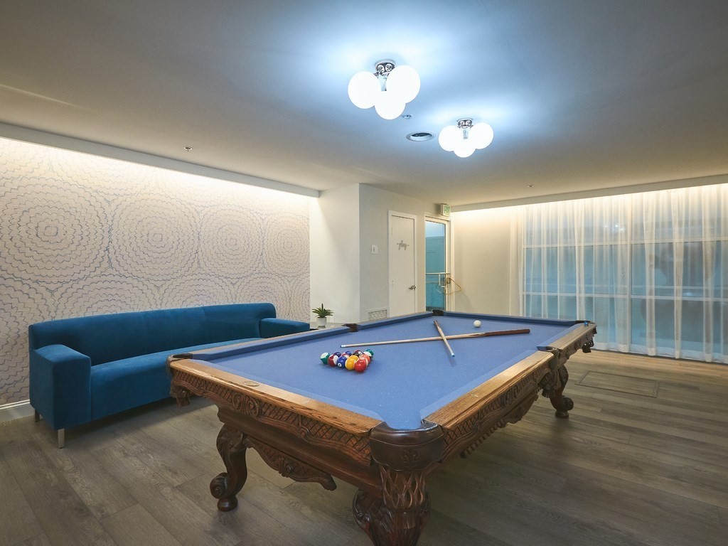 42 8th Street, Unit 5521 Boston, MA 02129 - Photo 21 of 25 a room with furniture pool table and windows