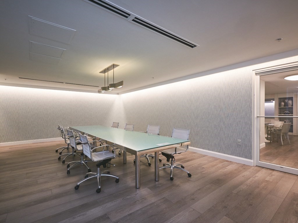 42 8th Street, Unit 5521 Boston, MA 02129 - Photo 22 of 25 a workspace with furniture and wooden floor