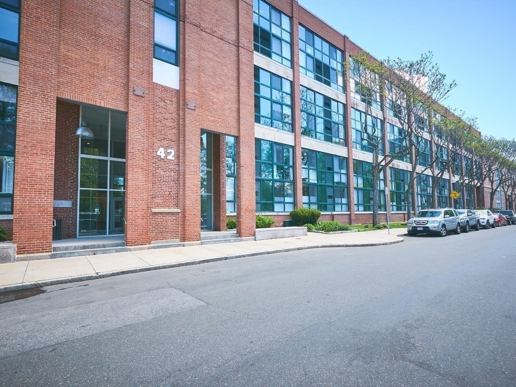 42 8th Street, Unit 5521 Boston, MA 02129 - Photo 24 of 25 front view of a building with a street