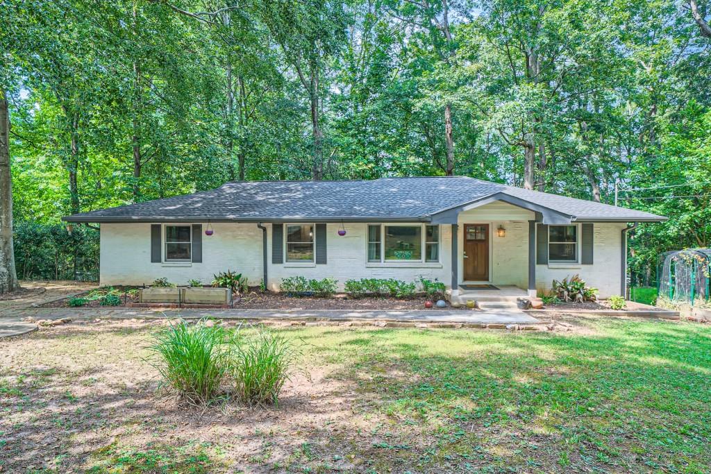 976 Milam Circle Clarkston, GA 30021 - Photo 1 of 1 a front view of house with yard outdoor seating and yard
