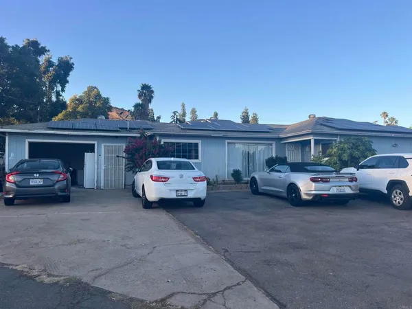 a view of parking space with cars parked