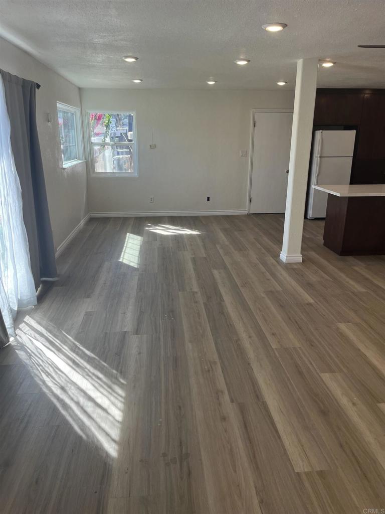 1280 Manor Drive El Cajon, CA 92021 - Photo 6 of 11 a view of room with wooden floor and window