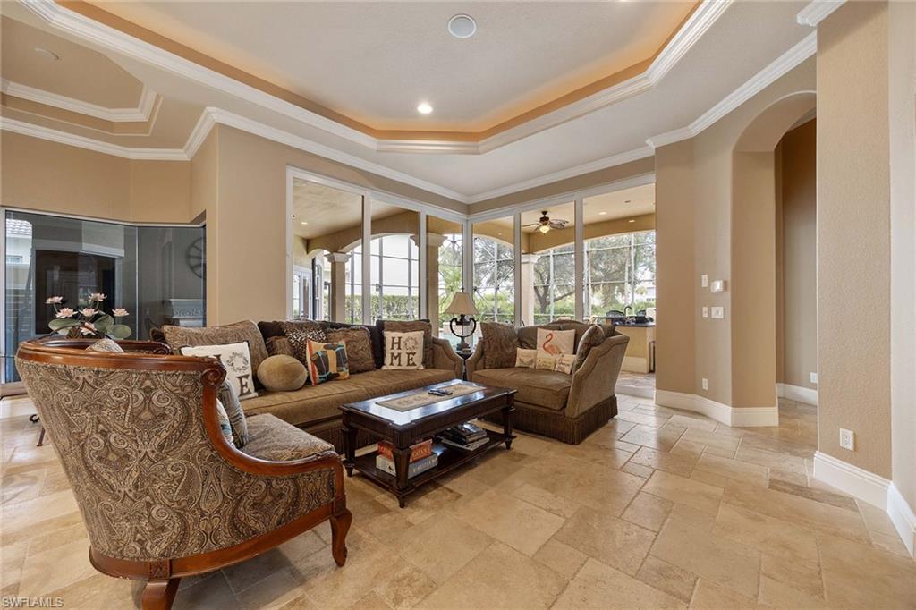 23801 Napoli Way Estero, FL 34134 - Photo 12 of 50 a living room with furniture and a large window