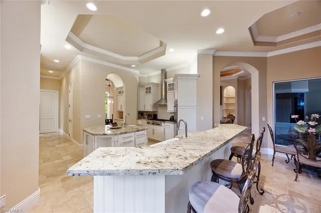 a view of a kitchen and dining table cabinets