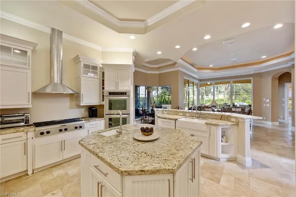 a kitchen with stainless steel appliances granite countertop a sink and cabinets