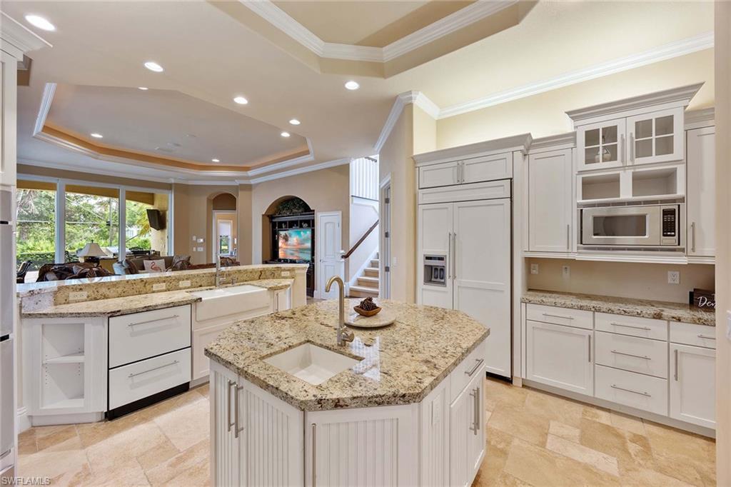 23801 Napoli Way Estero, FL 34134 - Photo 16 of 50 a kitchen with stainless steel appliances granite countertop a sink and cabinets