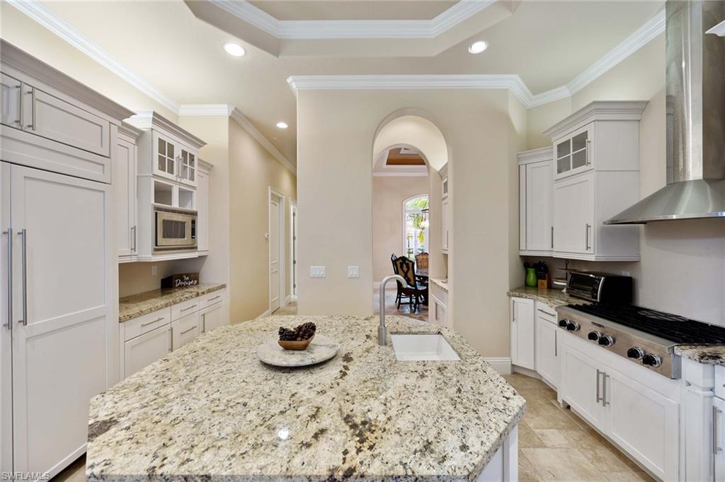 23801 Napoli Way Estero, FL 34134 - Photo 17 of 50 a kitchen with stainless steel appliances granite countertop a stove and a sink