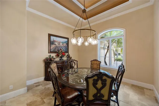 a view of a dining room with furniture and window