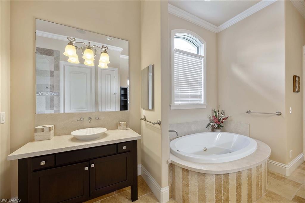 23801 Napoli Way Estero, FL 34134 - Photo 24 of 50 a bathroom with 2 sink and a mirror