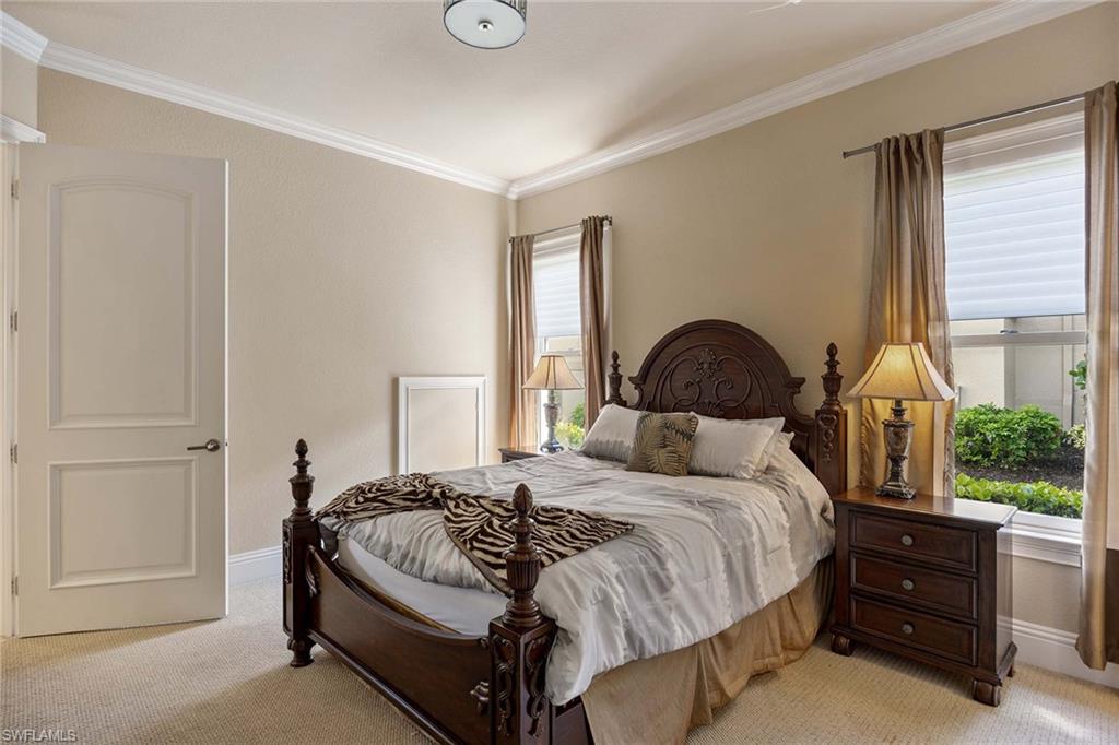 23801 Napoli Way Estero, FL 34134 - Photo 27 of 50 a bedroom with a bed and window