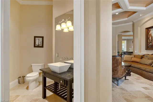 a bathroom with a sink toilet and mirror