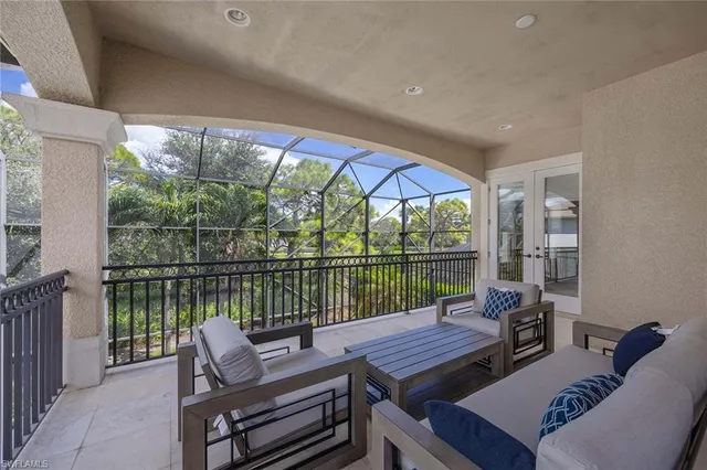 a balcony with wooden floor and outdoor space