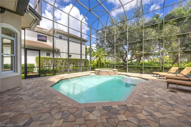 a view of indoor pool and sitting area