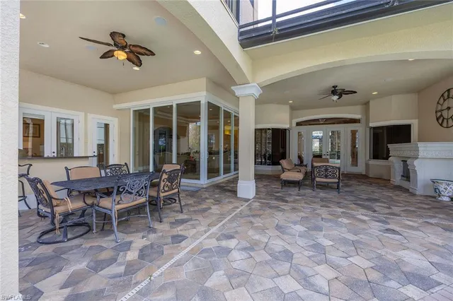 a living room with furniture a window and a table