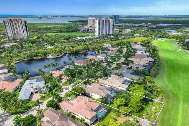 an aerial view of a house with outdoor space