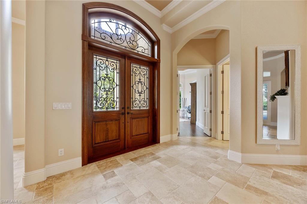 23801 Napoli Way Estero, FL 34134 - Photo 9 of 50 a view of an entryway with a front door