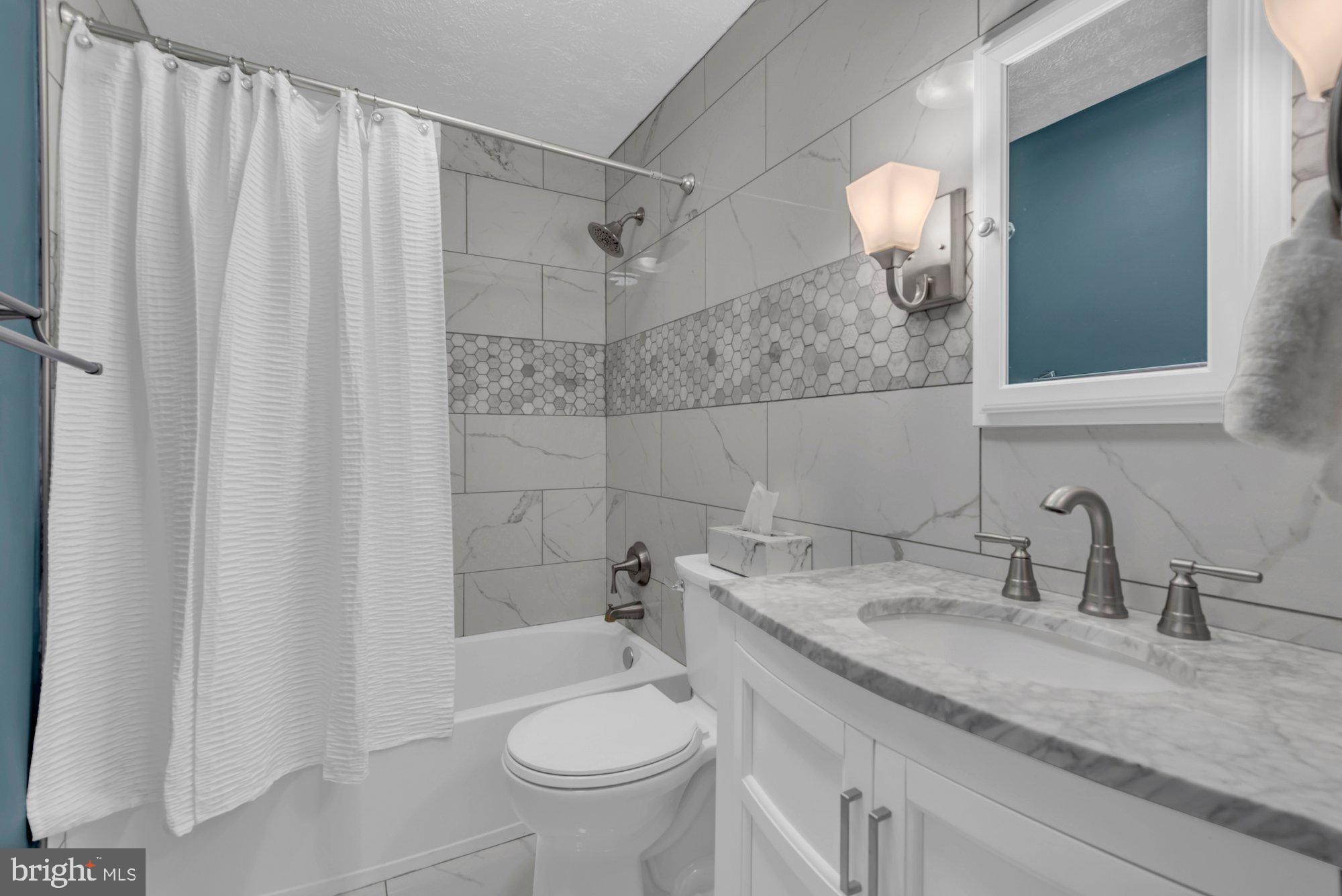 2513 Maytime Drive Gambrills, MD 21054 - Photo 16 of 40 a bathroom with a granite countertop sink toilet and shower