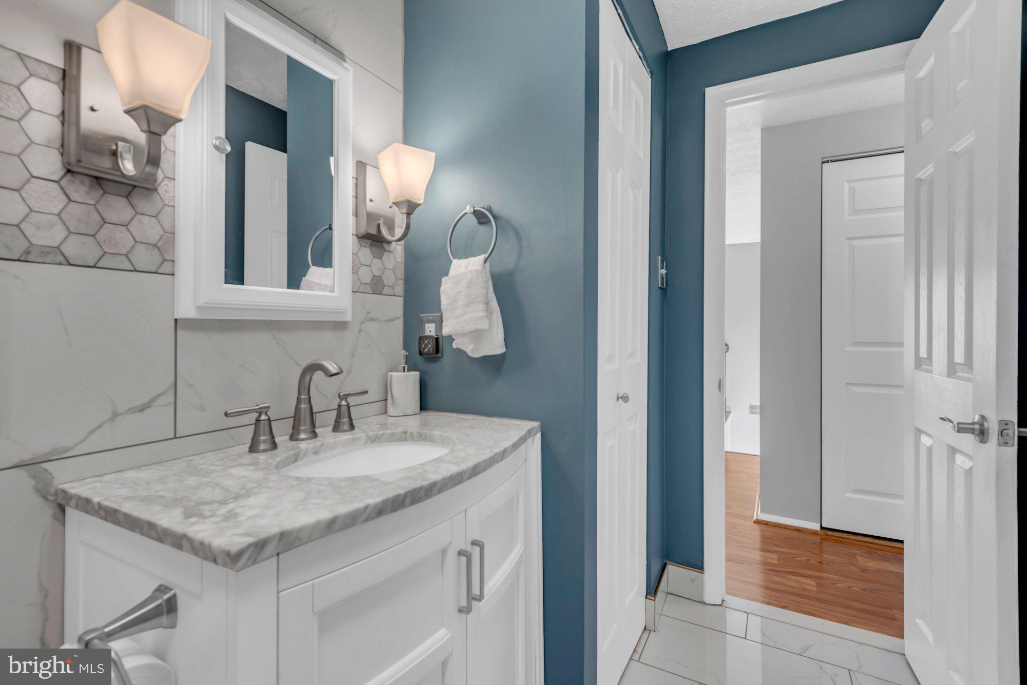 2513 Maytime Drive Gambrills, MD 21054 - Photo 17 of 40 a bathroom with a granite countertop sink and a mirror