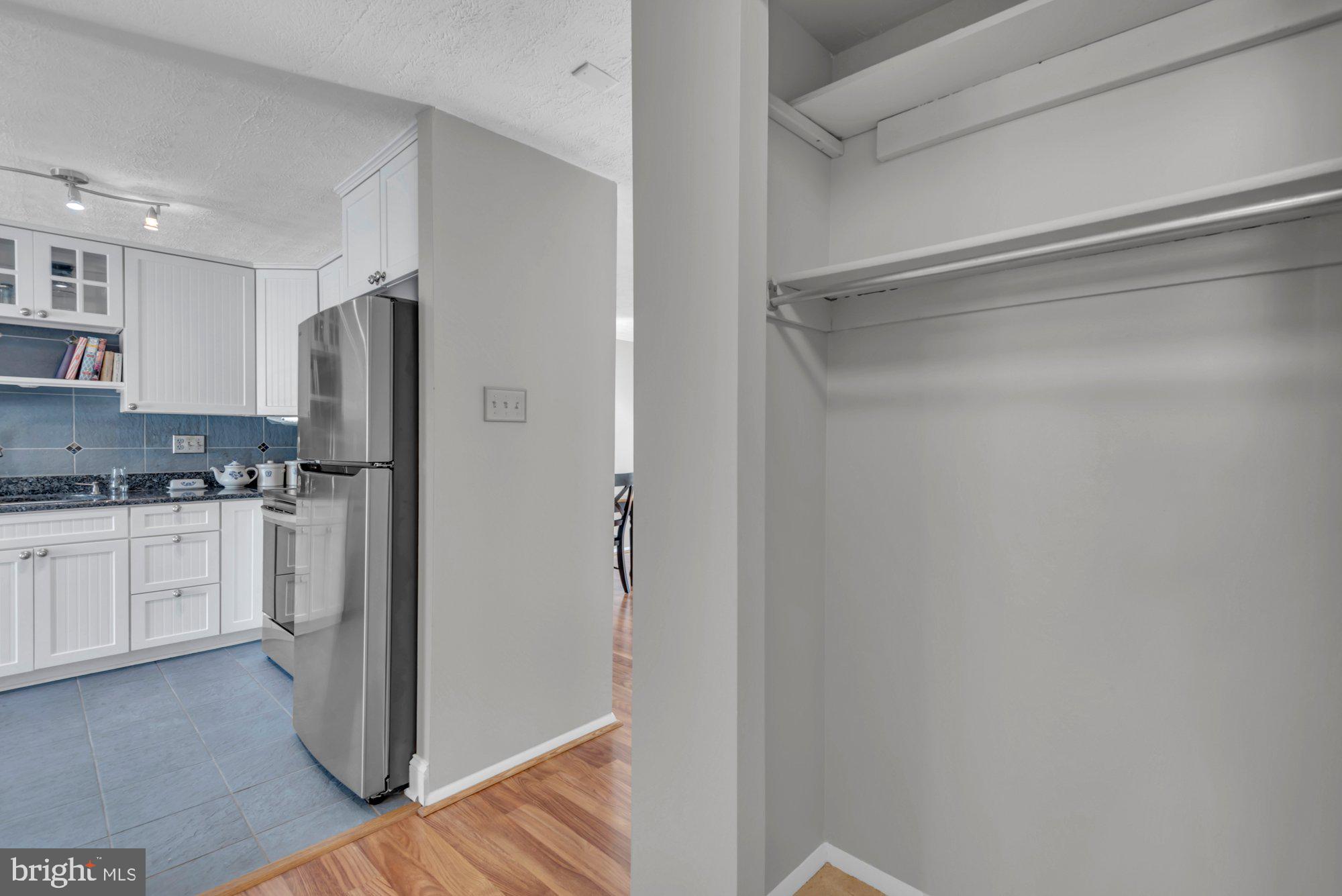 2513 Maytime Drive Gambrills, MD 21054 - Photo 18 of 40 a kitchen with a refrigerator and cabinets