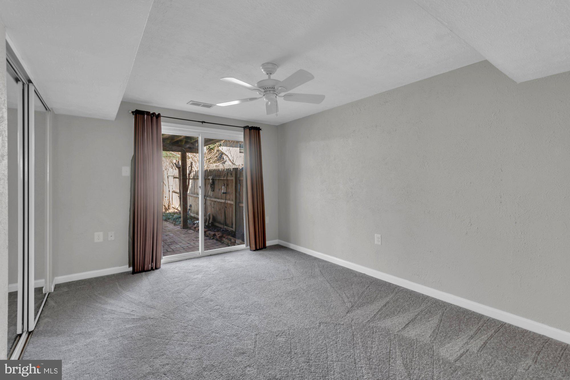 2513 Maytime Drive Gambrills, MD 21054 - Photo 31 of 40 an empty room with a ceiling fan and a window