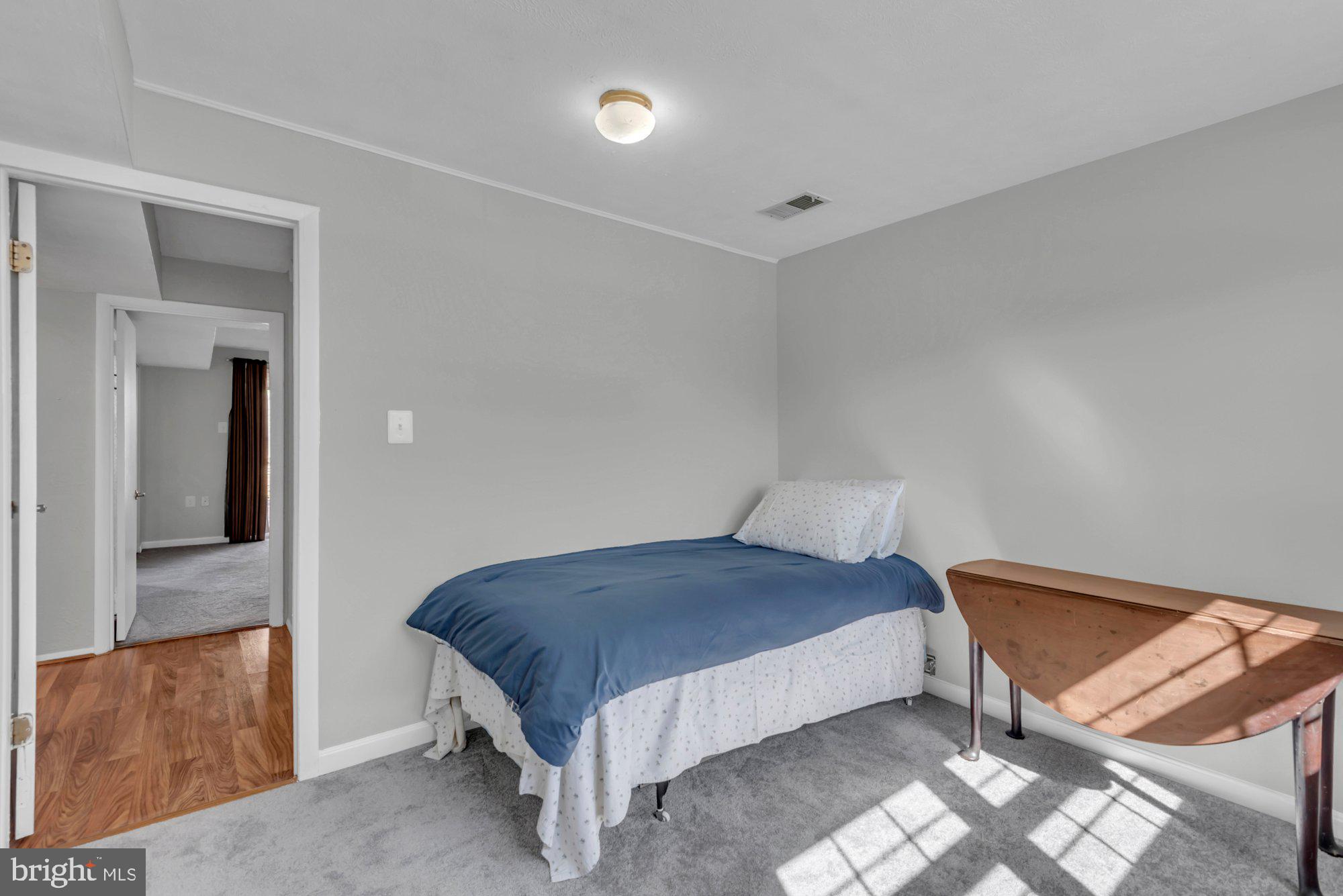 2513 Maytime Drive Gambrills, MD 21054 - Photo 33 of 40 a bedroom with a bed and a mirror