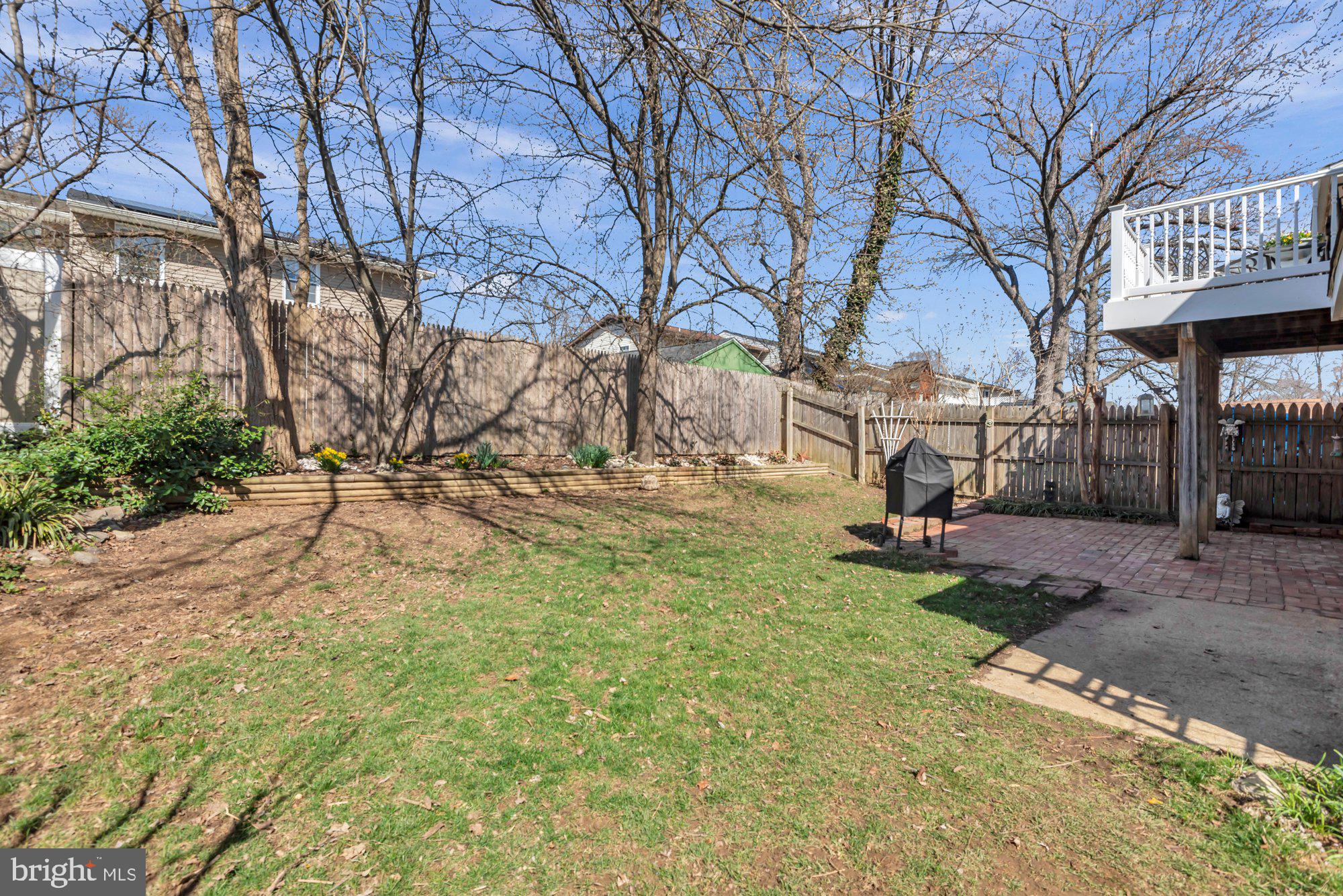 2513 Maytime Drive Gambrills, MD 21054 - Photo 37 of 40 a view of a yard with a house and a tree