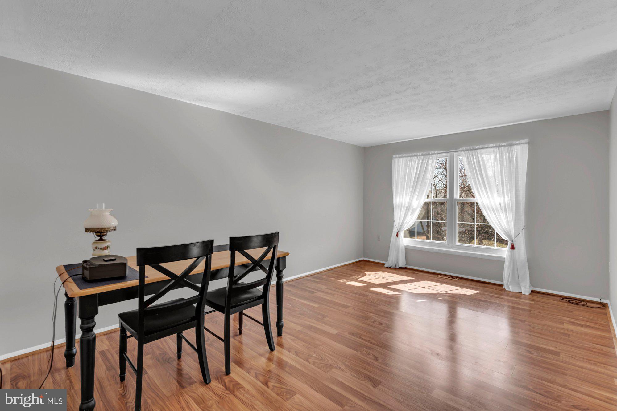 2513 Maytime Drive Gambrills, MD 21054 - Photo 5 of 40 a view of a livingroom with furniture and wooden floor