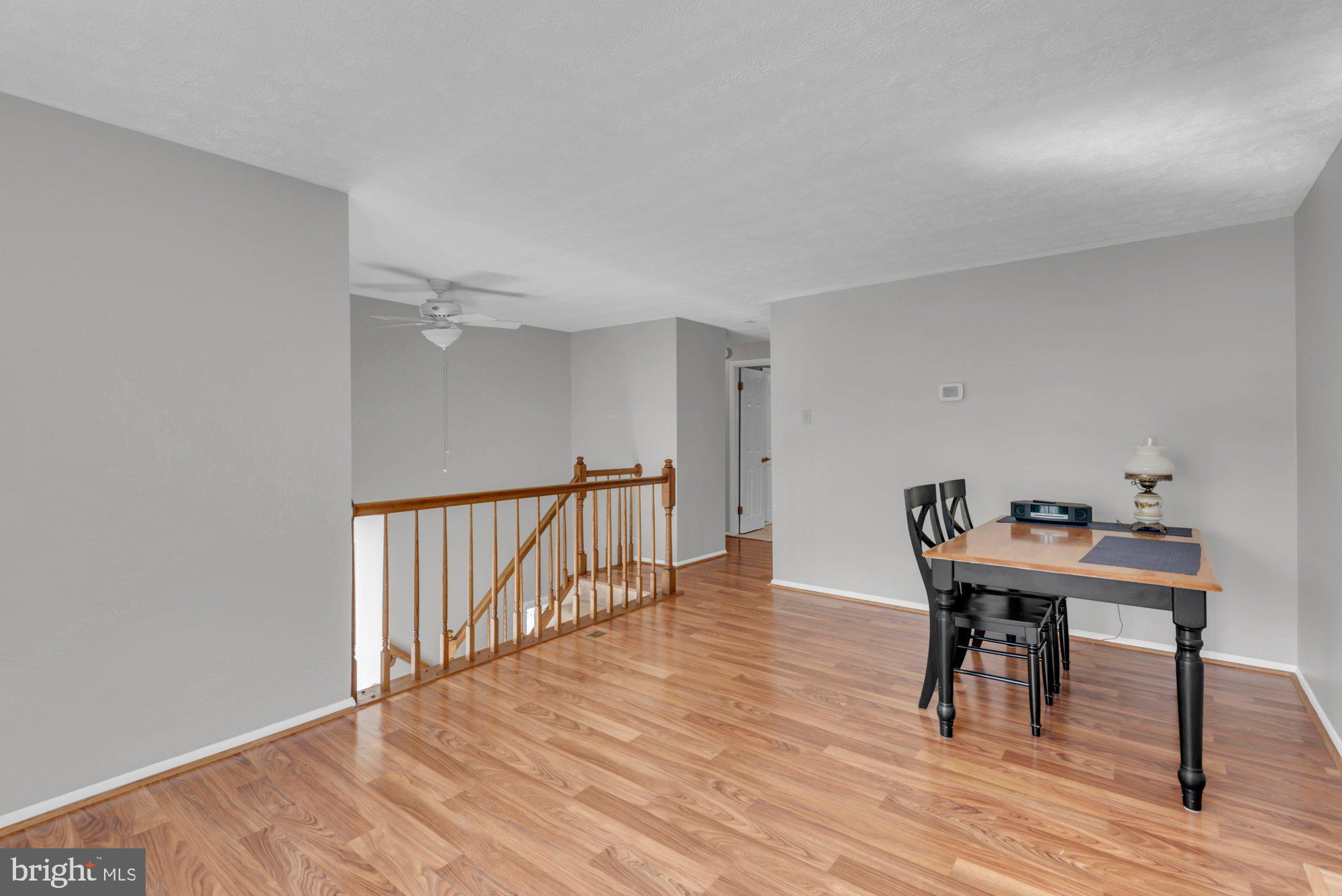 2513 Maytime Drive Gambrills, MD 21054 - Photo 6 of 40 a view of a workspace with furniture and wooden floor