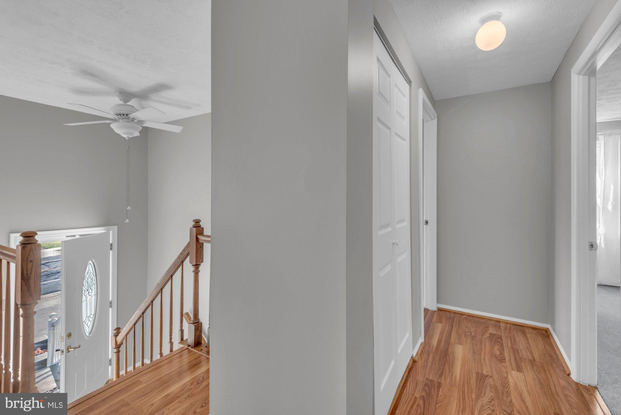 2513 Maytime Drive Gambrills, MD 21054 - Photo 7 of 40 a view of a hallway with entryway wooden floor and front door