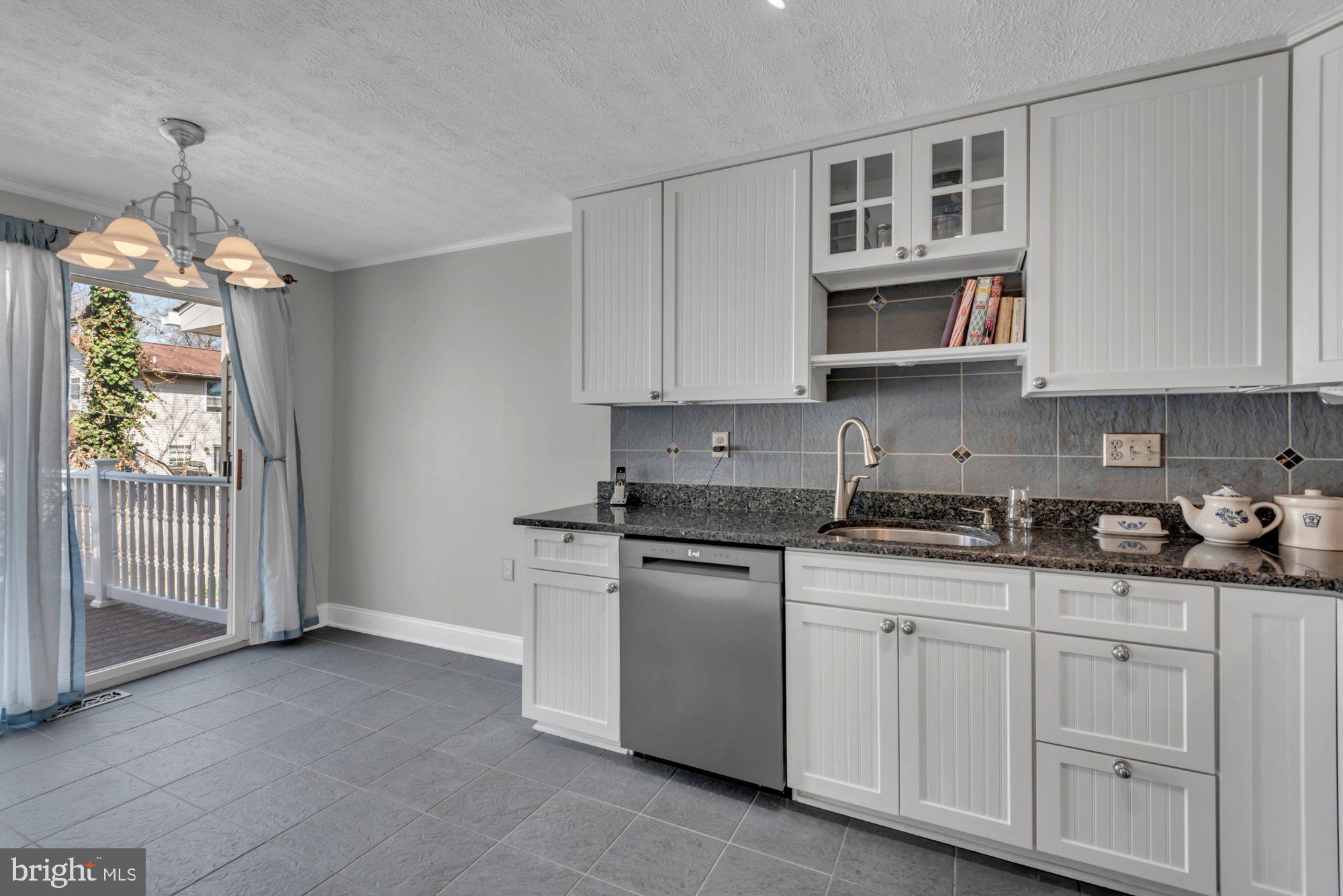 2513 Maytime Drive Gambrills, MD 21054 - Photo 10 of 40 a kitchen with stainless steel appliances granite countertop a stove a sink and a microwave