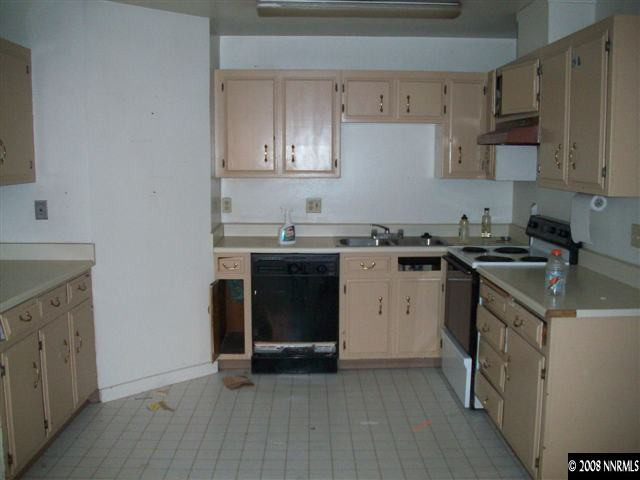 3270 Heights Reno, NV 89503 - Photo 3 of 9 a kitchen with a sink stove and cabinets