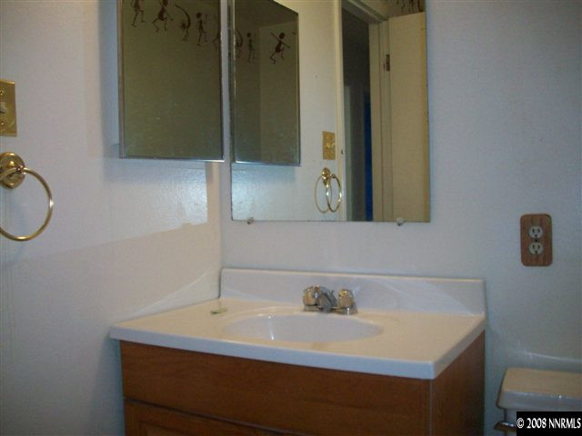 3270 Heights Reno, NV 89503 - Photo 8 of 9 a bathroom with a sink and a mirror