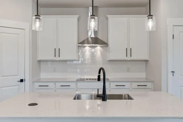 a kitchen with a sink and cabinets