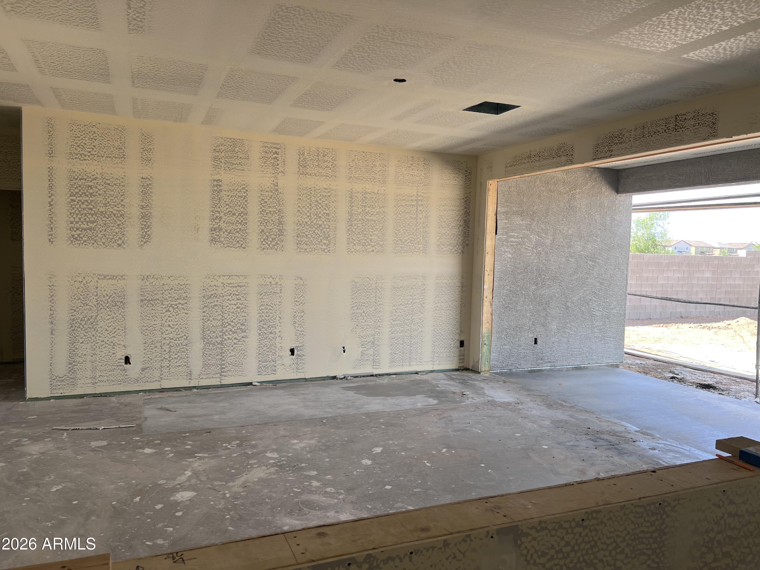 9626 West Gaby Road Tolleson, AZ 85353 - Photo 6 of 15 a view of an empty room with a window