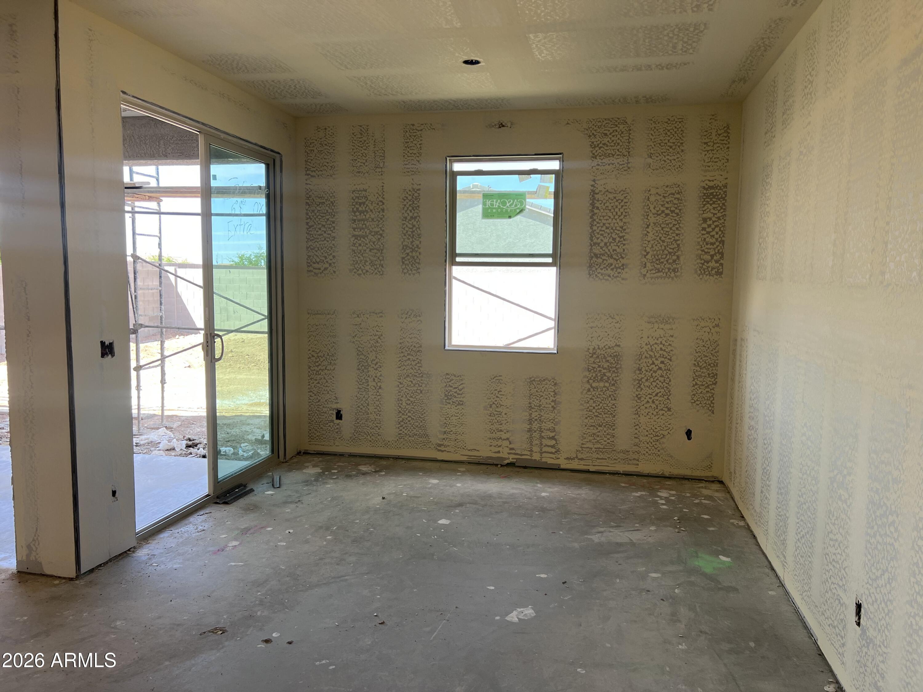 9626 West Gaby Road Tolleson, AZ 85353 - Photo 7 of 15 an empty room with windows