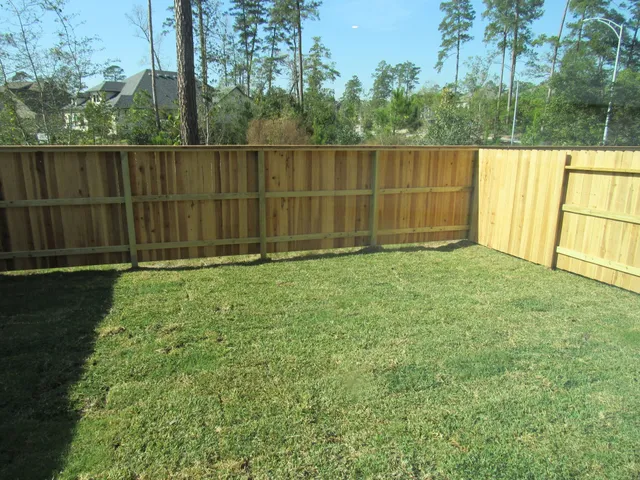 a view of outdoor space with a fence