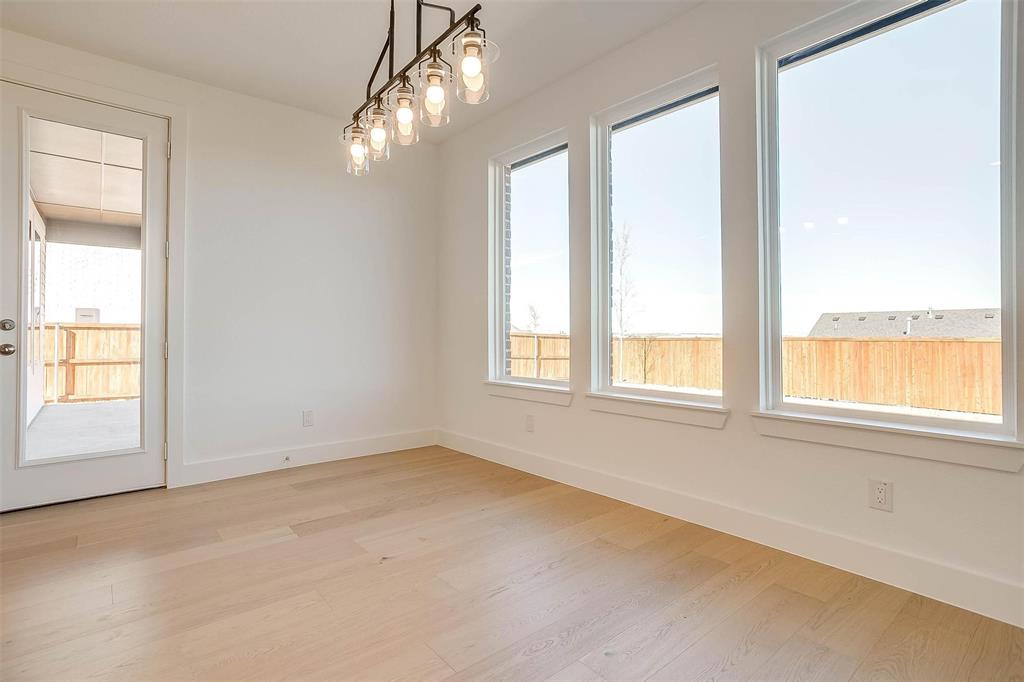 826 Feathergrass Place Haslet, TX 76052 - Photo 14 of 35 an empty room with a empty space and windows