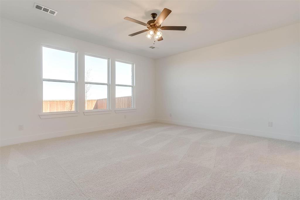 826 Feathergrass Place Haslet, TX 76052 - Photo 17 of 35 an empty room with a window and a ceiling fan