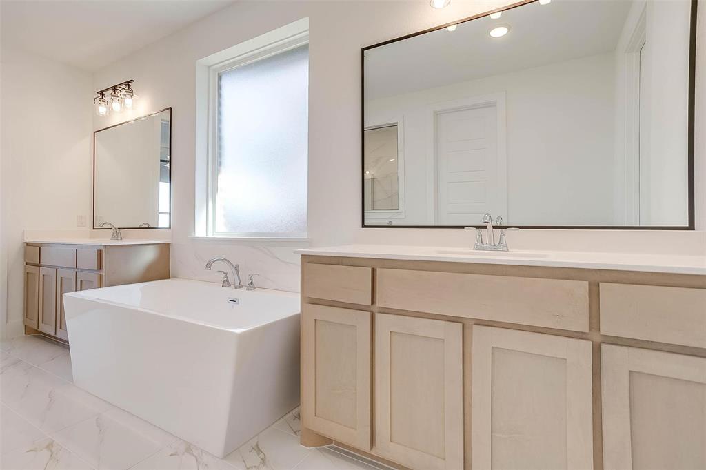 826 Feathergrass Place Haslet, TX 76052 - Photo 20 of 35 a bathroom with a sink and a mirror