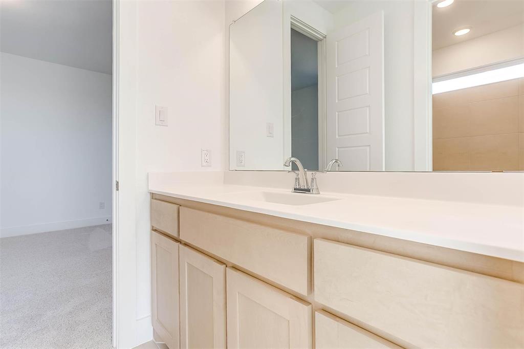 826 Feathergrass Place Haslet, TX 76052 - Photo 29 of 35 a bathroom with a sink and a mirror