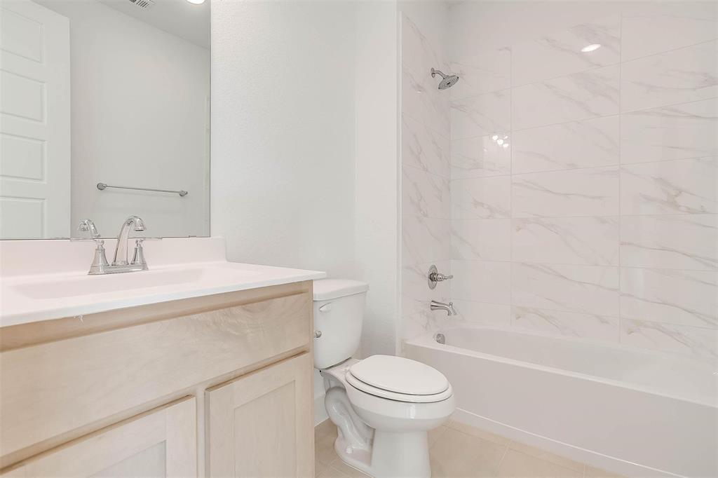 826 Feathergrass Place Haslet, TX 76052 - Photo 32 of 35 a bathroom with a sink a toilet and a bathtub